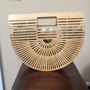 Small bamboo handbag w/insert to keep items secure.
